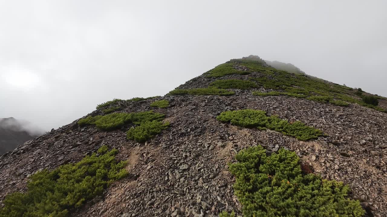 Experience breathtaking mountain slopes with sweeping drone views capturing the intricate terrain