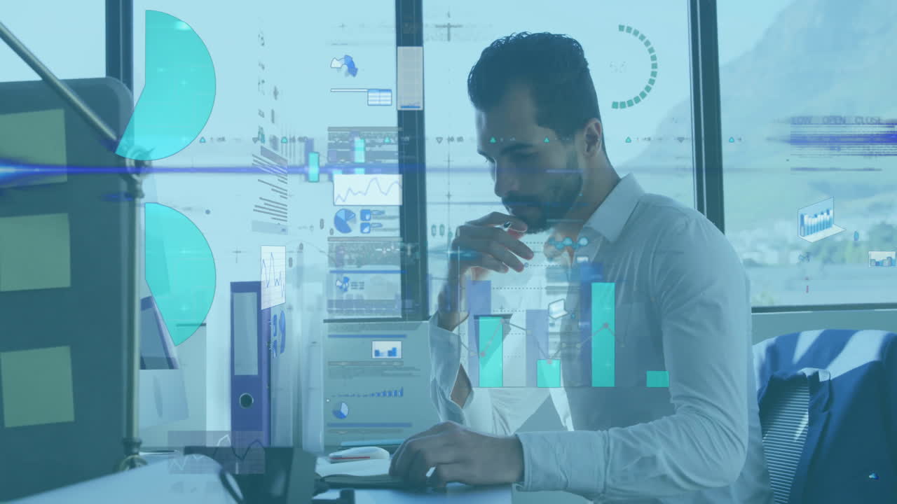 Animation of financial data processing over caucasian businessman working at office