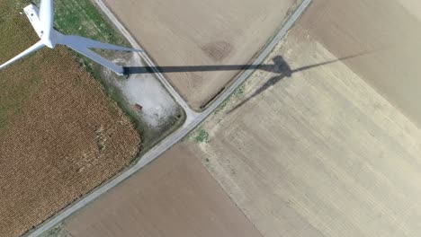 aerial drone shot of windmill on farmland