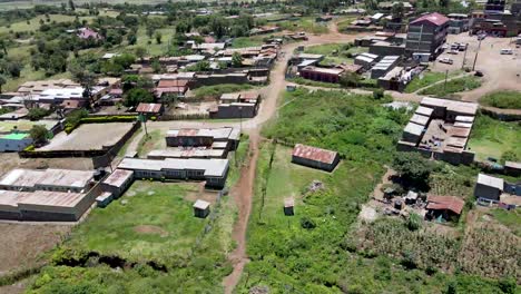 city scape-rural africa-drone view-a rural africa market with the green farms. a drone flying over the rural village in the south of kenya loitokitok