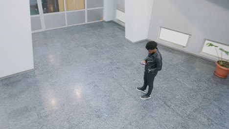 people gather and converse in a modern hallway