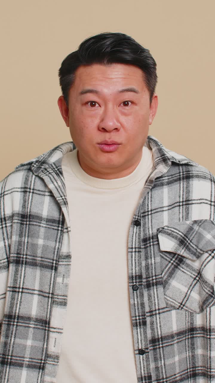 Asian man being uninvolved clueless face expression feels innocent not his fault fail mistake