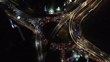 aerial view of night traffic on city highway intersection
