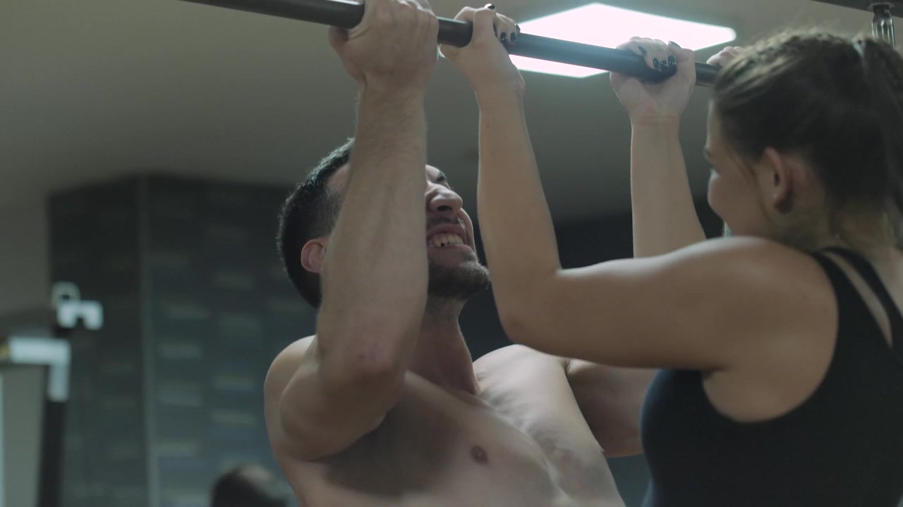- Male and female workout together in the gym
- 4K slowmotion