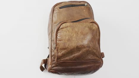 Brown-camping-rucksack-and-copy-space-on-white-background