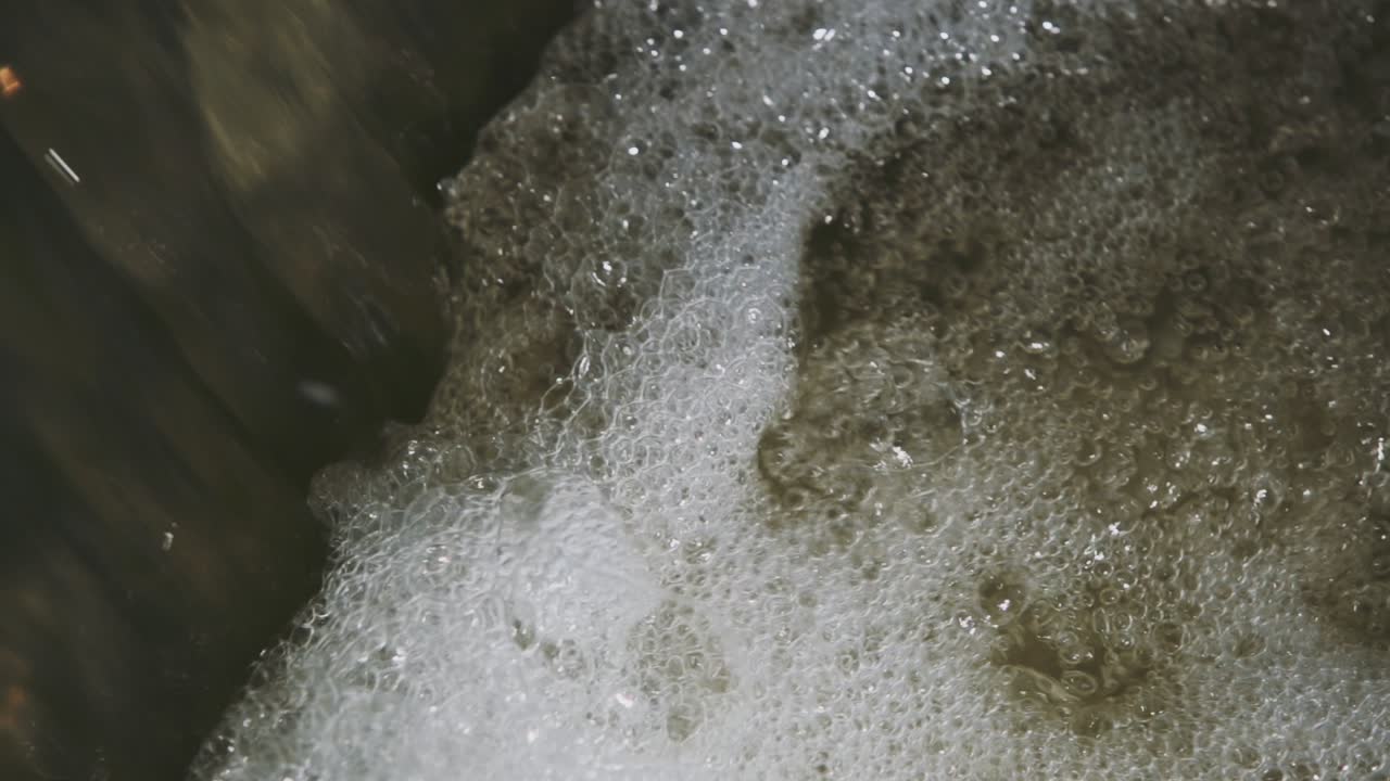 Water close-up with higher perspective view from the foaming and more bubbling water near in Velence Lake, Hungary