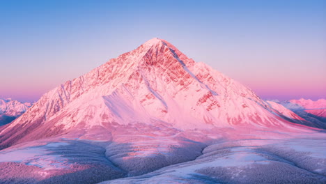 majestic snow-covered mountain peak at sunrise or sunset