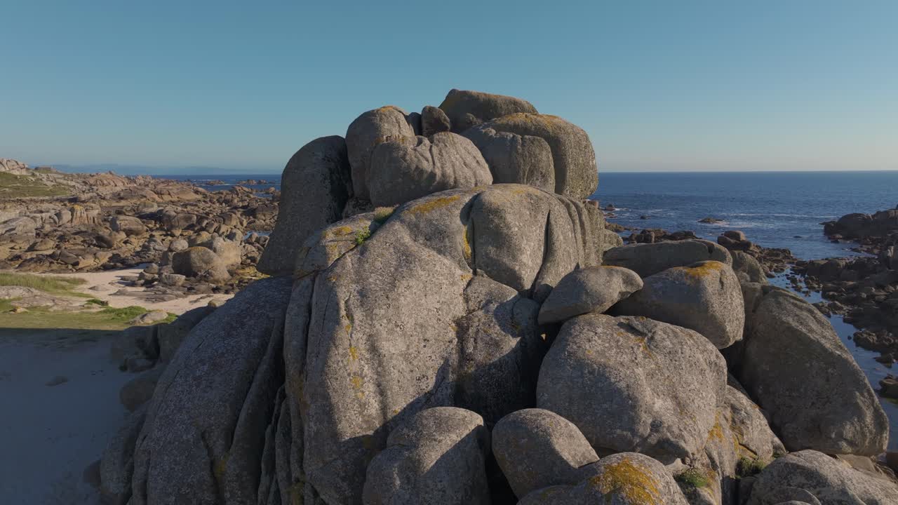 Boulders On The Shores Of Con Negro Beach In San Vicente do Grove In Galicia, Spain. Aerial Drone Shot