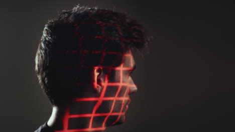 Facial-Recognition-Technology-Concept-As-Man-Has-Red-Grid-Projected-Onto-Eye-In-Studio