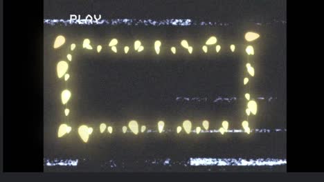 Animation-of-frame-of-glowing-yellow-christmas-fairy-lights-on-playback-screen,-with-interference