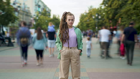 woman with dreadlocks on a city street