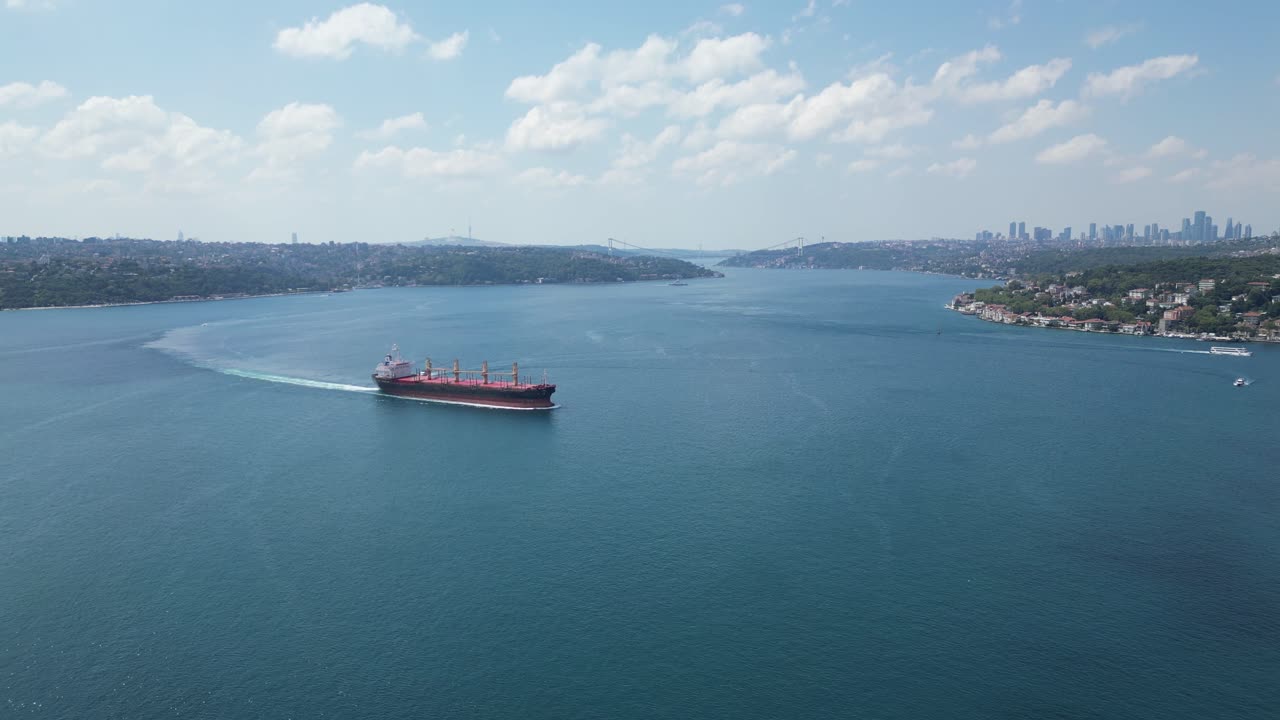 Aerial view a cargo ship through calm waters of Bosporus Sea