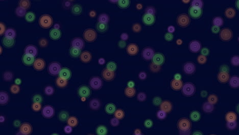 vibrant, multicolored circles against a dark backdrop create a visually striking and dynamic pattern in this abstract image