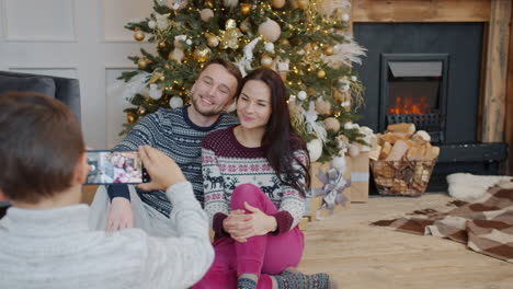 family photo by christmas tree
