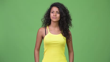 young beautiful hispanic woman with curly hair
