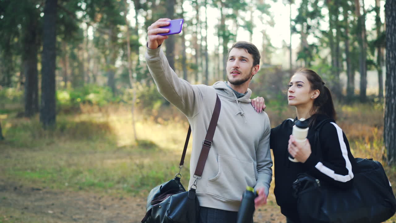 Couple Taking a Selfie in a Forest