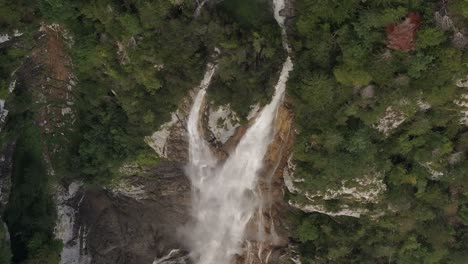 drone aerial view of seerenbachfälle waterfall, surrounded by vibrant greenery in amden, betlis, kanton sg, switzerland.