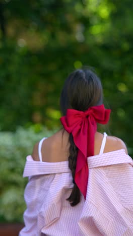 girl in a park, back view