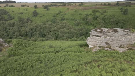 4k-Aerial-of-Bridstones-sandstone-rock-formations-in-Dalby-Forest,-North-Yorkshire