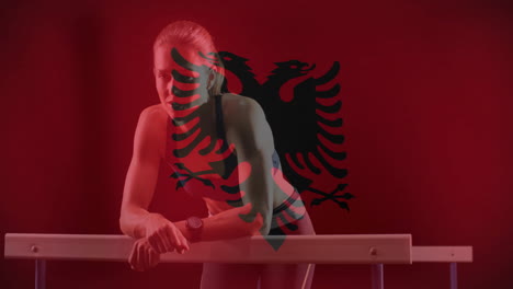 animation of flag of albania over caucasian female runner