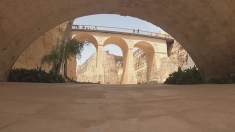 the bridge leading to city gate of valletta, malta