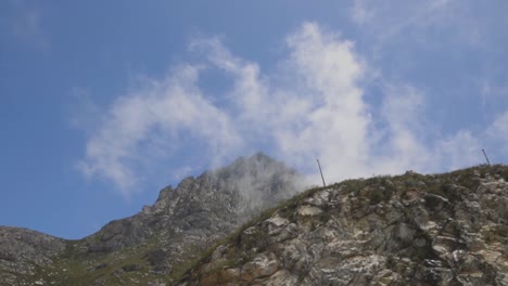 smoke drifts over the rocky hills in the wind