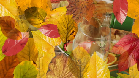 Animation-of-autumn-leaves-over-thanksgiving-dinner-background