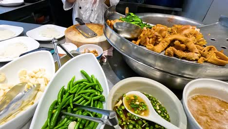 chefs preparing traditional thai stewed pork leg