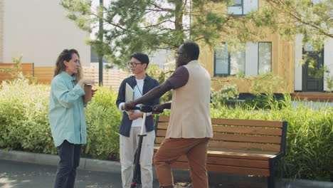 Team-of-Multiethnic-Colleagues-Talking-on-Street