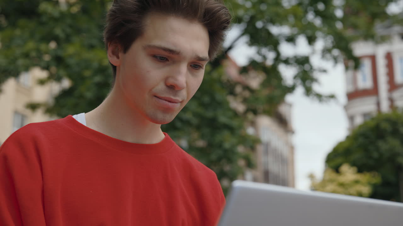A young man outside in the city