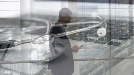 animation of stethoscope on the keyboard over businessmen