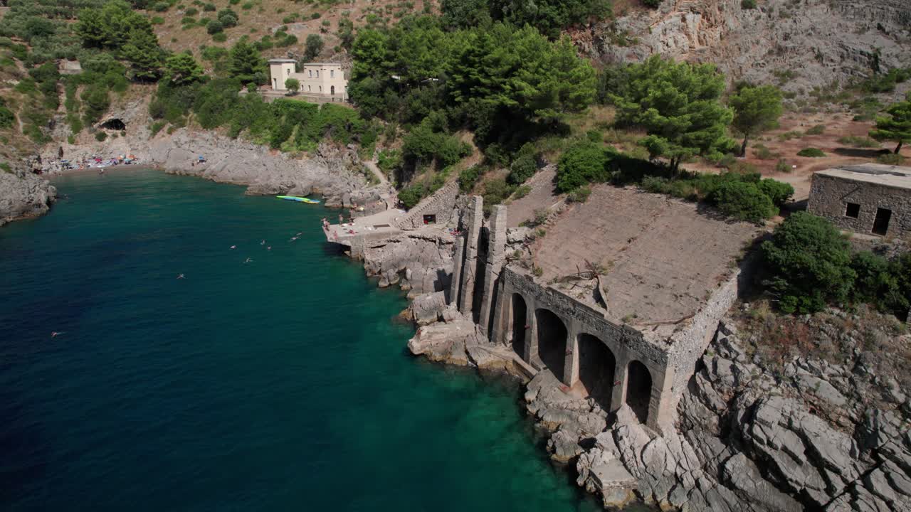 Aerial circle view of wonderful bay whit ancient buildings perched. Ieranto. Salerno. Italy