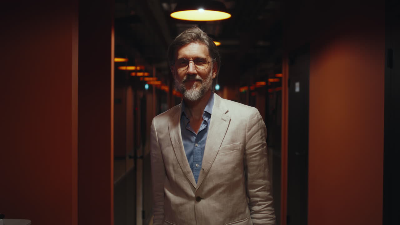 Female Office Worker Speaking on Smartphone Shot of Caucasian Female Office Worker Speaking on Smartphone while Working on Laptop in it Office