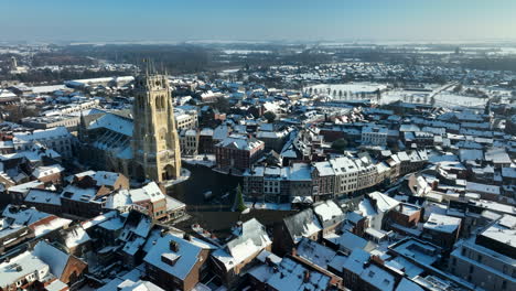 Aerial-flying-near-Basilica-of-Our-Lady-on-winter-day,-Tongeren,-Belgium