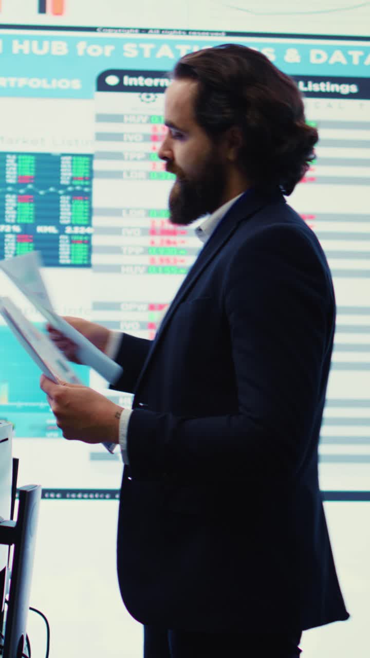 Businessman Discussing Financial Data with Colleagues in Modern Office