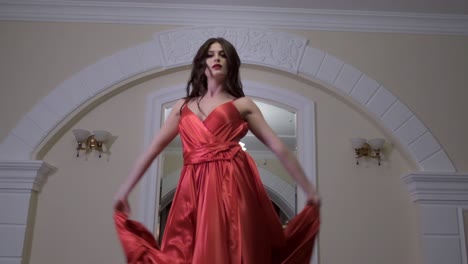woman in red satin evening gown