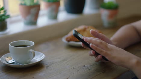 woman-hands-using-smartphone-browsing-online-messages-relaxing-in-coffee-shop-texting-enjoying-mobile-phone-sharing-lifestyle-on-social-media-close-up