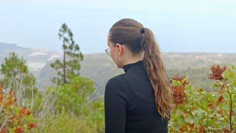 attractive brunette enjoys panoramic view of tenerife