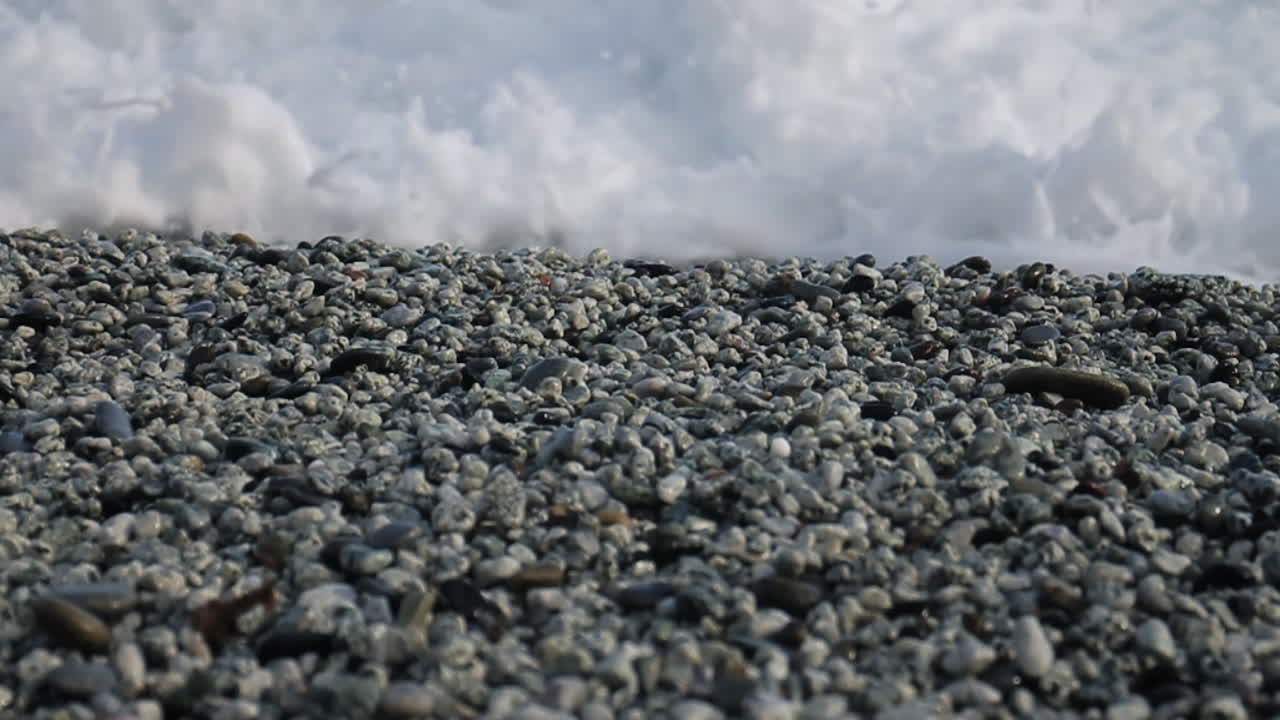 Pebble Beach with Crashing Waves
