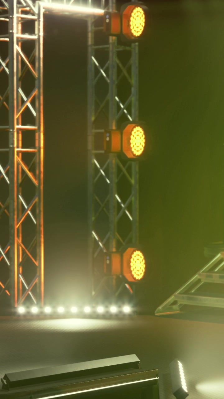 Stage lights set up for a performance at an indoor venue in the evening