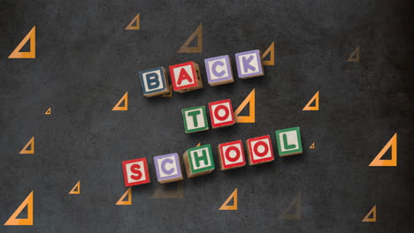 animation of back to school text over school items icons and blackboard