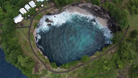 Aerial-Birds-Eye-View-Over-Broken-Beach-With-Waves-Crashing-On-Shoreline