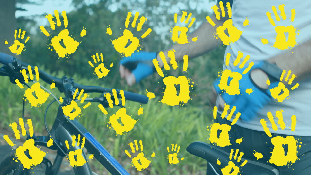 Animação de impressões de mãos sobre um homem caucasiano a andar de bicicleta