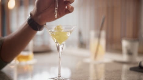 preparing a martini cocktail