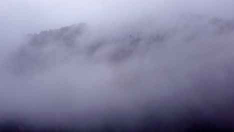 aerial view of mountain moving clouds during autumn fall in vosges, france, 4k