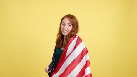 happy woman wrapped in american flag