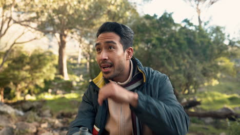 Man,-hiking-and-drinking-water-from-bottle