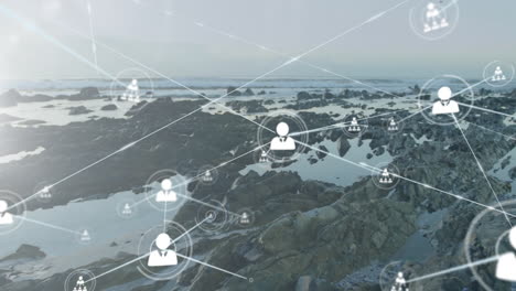 network of connections and data processing animation over rocky coastal landscape