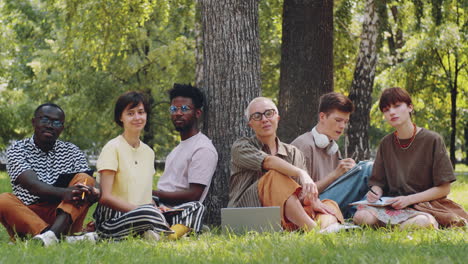 portrait of multiethnic students and teacher in park