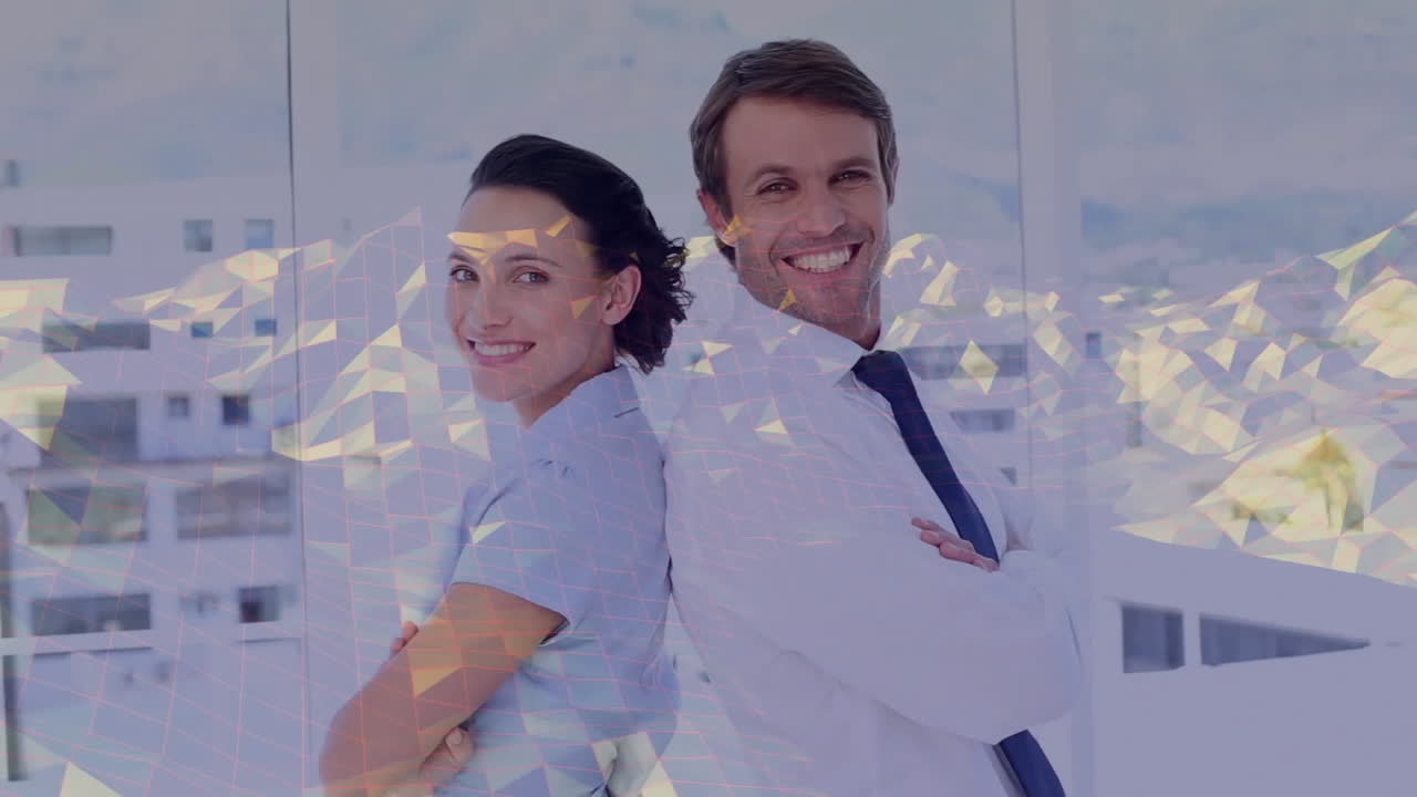 Standing back-to-back, business professionals smiling with geometric animation overlay